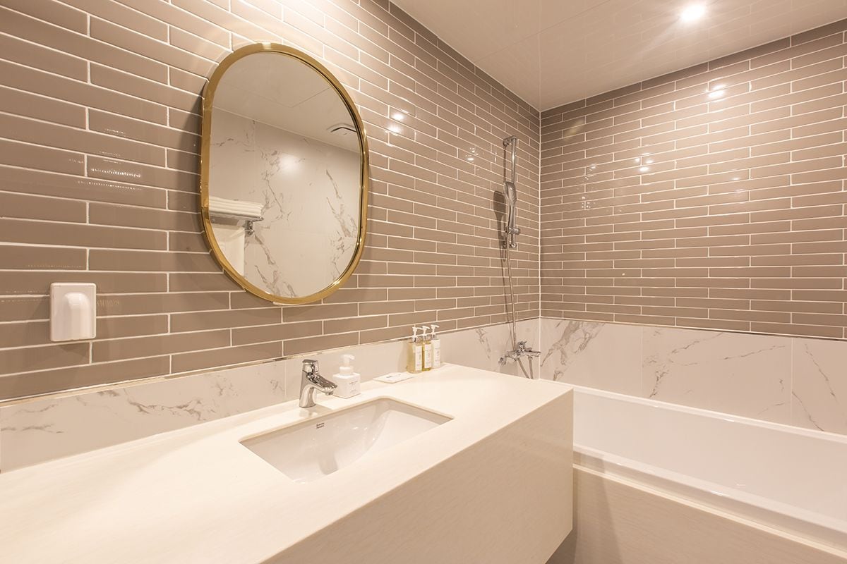 premium double room, ocean view | bathroom | combined shower/bathtub, deep-soaking bathtub, designer toiletries