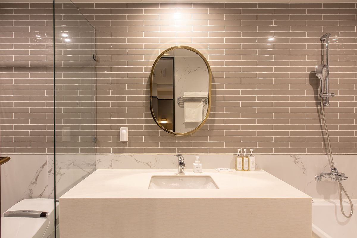 premium double room, ocean view | bathroom | combined shower/bathtub, deep-soaking bathtub, designer toiletries