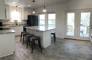 Enjoy casual dining and cooking at the central island with bar stools.