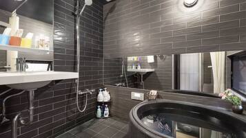 Bathtub, hair dryer, bidet, towels