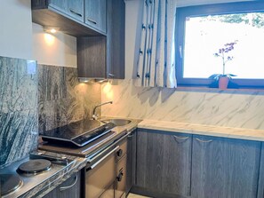 Fridge, oven, high chair, cookware/dishes/utensils