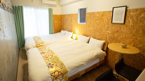 A hotel room with two beds, a small round table, and a chair. - Rest inn Kyoto (Kyoto)