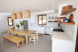 Fridge, microwave, coffee/tea maker, cookware/dishes/utensils