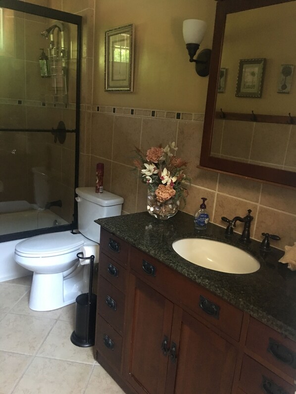 A bathroom with a toilet, sink, and shower. - Fallbrook Tuscan villa oasis! (Fallbrook)