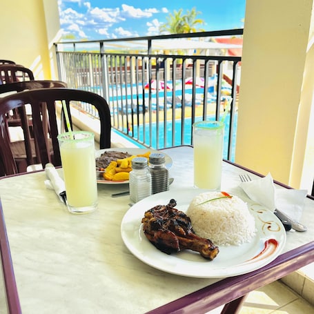 Breakfast, lunch served; local and international cuisine, pool views