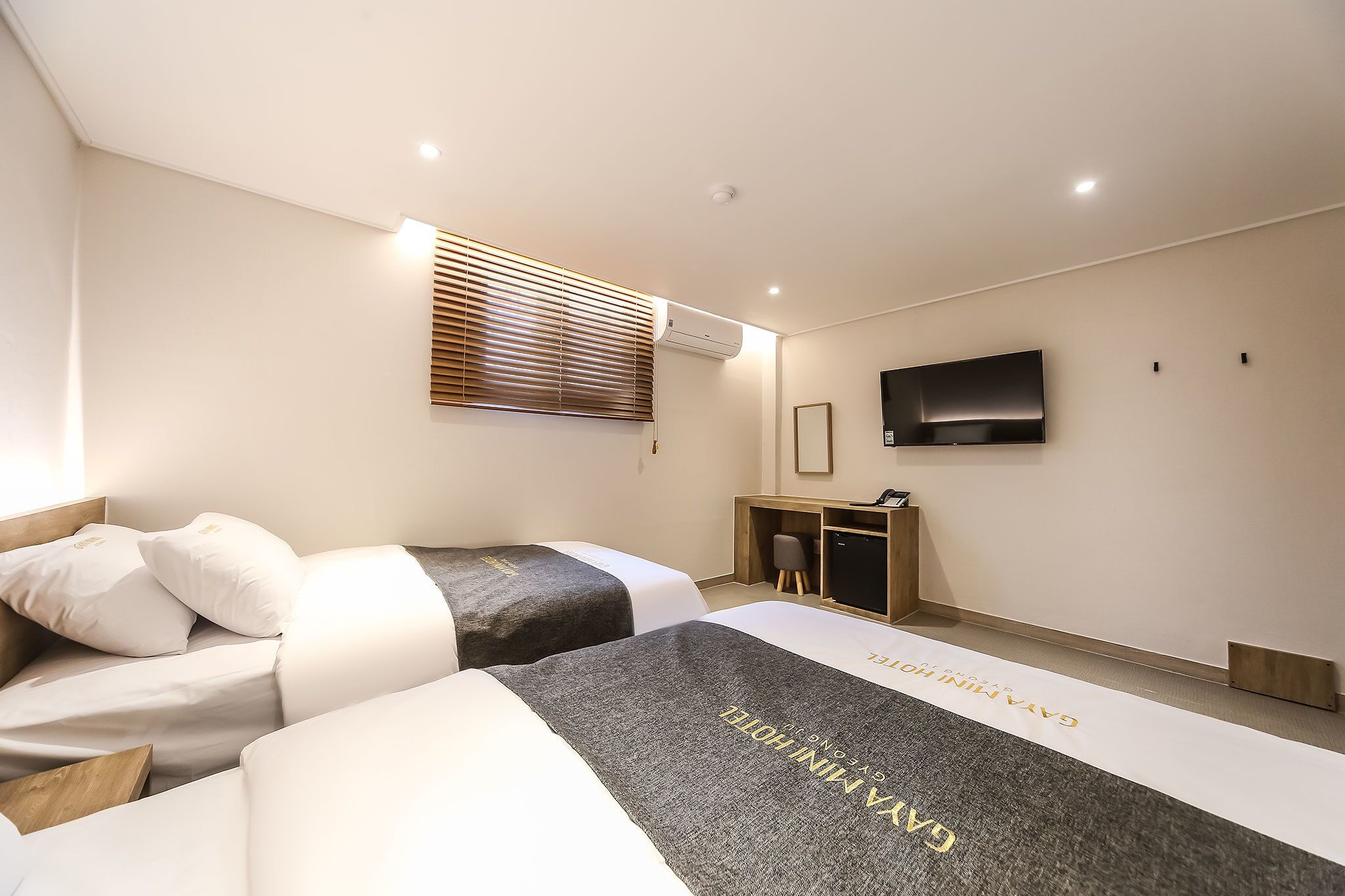 deluxe twin room | premium bedding, memory-foam beds, desk, laptop workspace