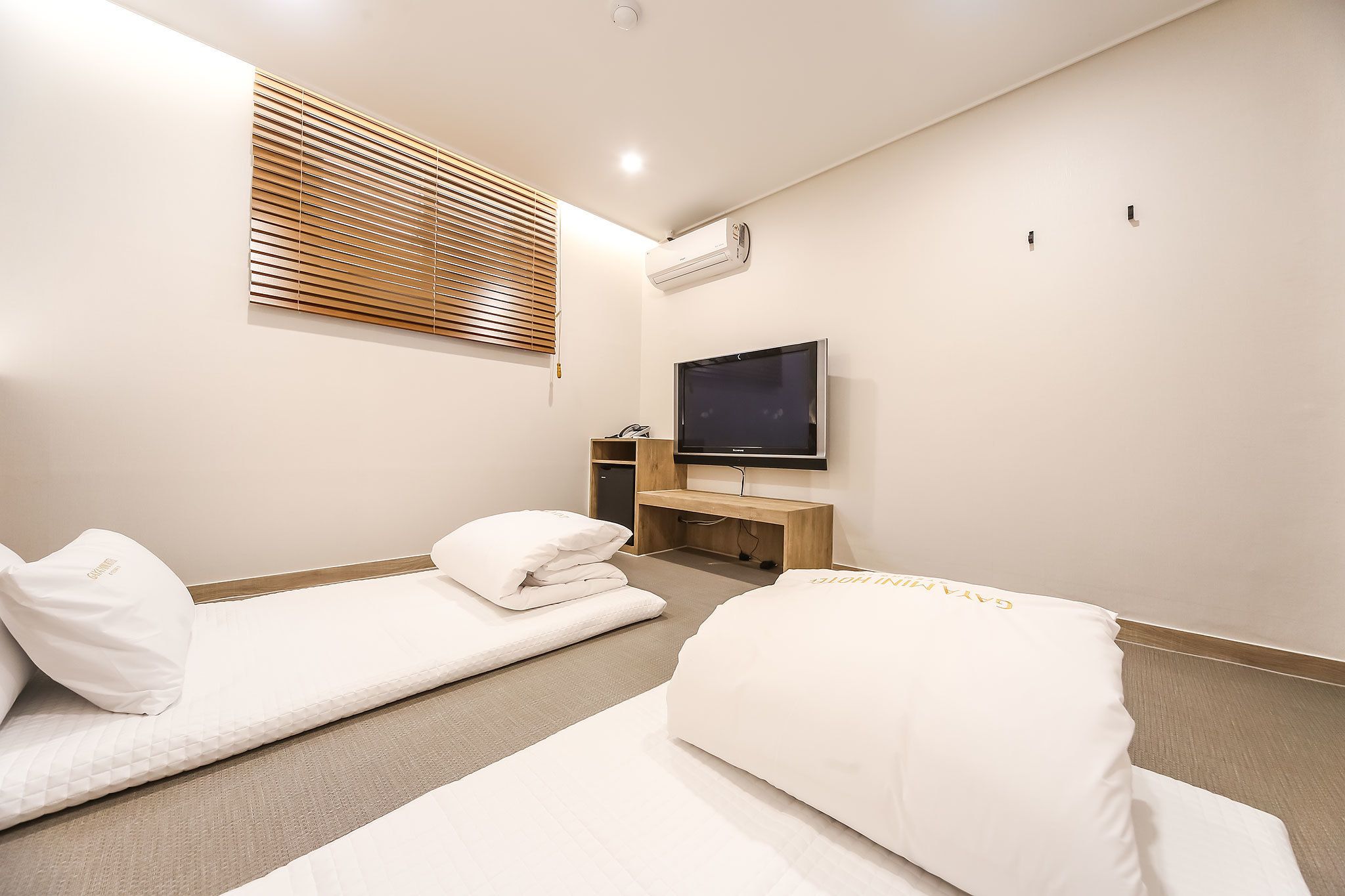 standard room (korean style heating) | premium bedding, memory-foam beds, desk, laptop workspace