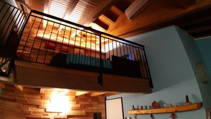 A wooden balcony with a railing, a staircase leading to an upper level, and a wall with a built-in shelf. - Ca 'De' Mumi, New Opening Old Town from 5 Apr '19 (Luino)