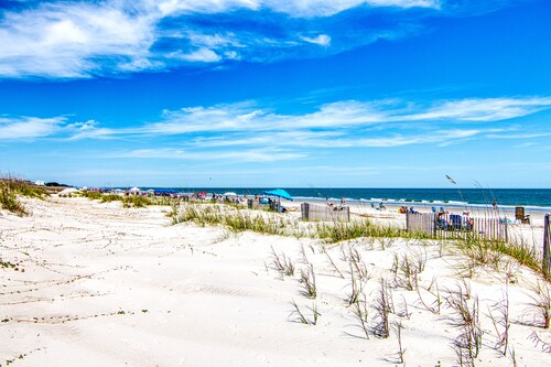 Oceanfront with easy beach access, large pool, and tiki bar/restaurant!