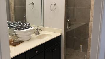 Combined shower/tub, hair dryer, towels, soap