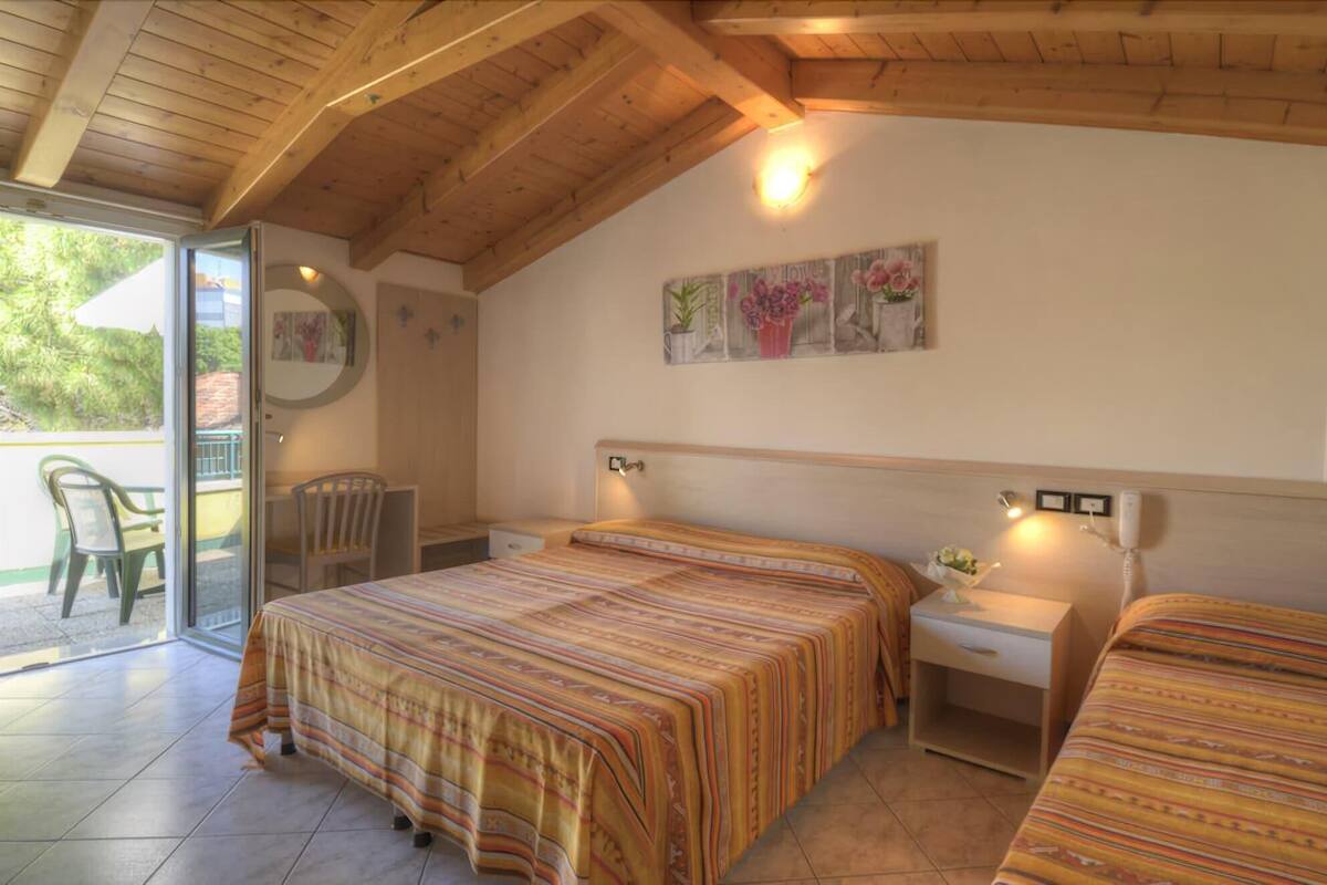 Habitación triple familiar, varias camas