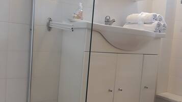 Suite, 2 Double Beds | Bathroom | Shower, free toiletries, hair dryer, towels