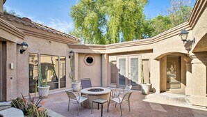 A patio with a fire pit, seating, and potted plants. - "Scottsdale Gem Near Pickleball Courts & Park!" (Scottsdale)