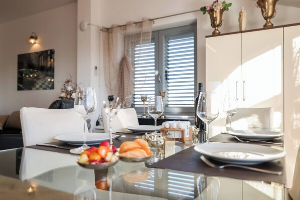 Apartment, Sea View | Living room | Flat-screen TV