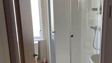 Shower, hair dryer, towels, toilet paper