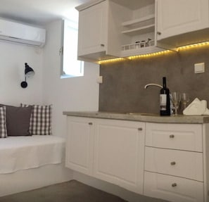 Apartment, 2 Bedrooms, Partial Sea View | Private kitchenette | Full-sized fridge, oven, stovetop, espresso maker