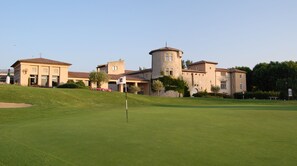 Stunning clubhouse with Mediterranean architecture, set amidst beautifully manicured grounds.