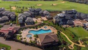 A residential area with houses, a swimming pool, and a golf course. - Pili Mai 3L Newly Upgraded 3 Bedroom Suite in Poipu - AC, Pool & Fitness Center (Koloa)