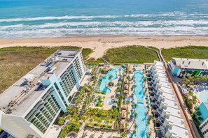A resort with a large pool area, multiple swimming pools, and a beach view. - Luxe 28th-Floor S Tower Condo: Ocean & SpaceX View (South Padre Island)