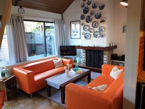 TV, fireplace, books, stereo