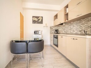 Fridge, microwave, cookware/dishes/utensils