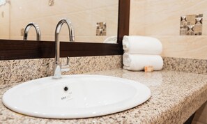 Deluxe Double Room, 1 King Bed | Bathroom | Shower, free toiletries, hair dryer