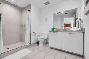 Shower, hair dryer, towels, soap