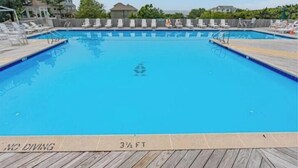 A clear blue pool with a wooden deck, a 'NO DIVING' sign, and a depth marker of 3 1/2 feet. - The Taylor at Ships Watch in Duck (Duck)