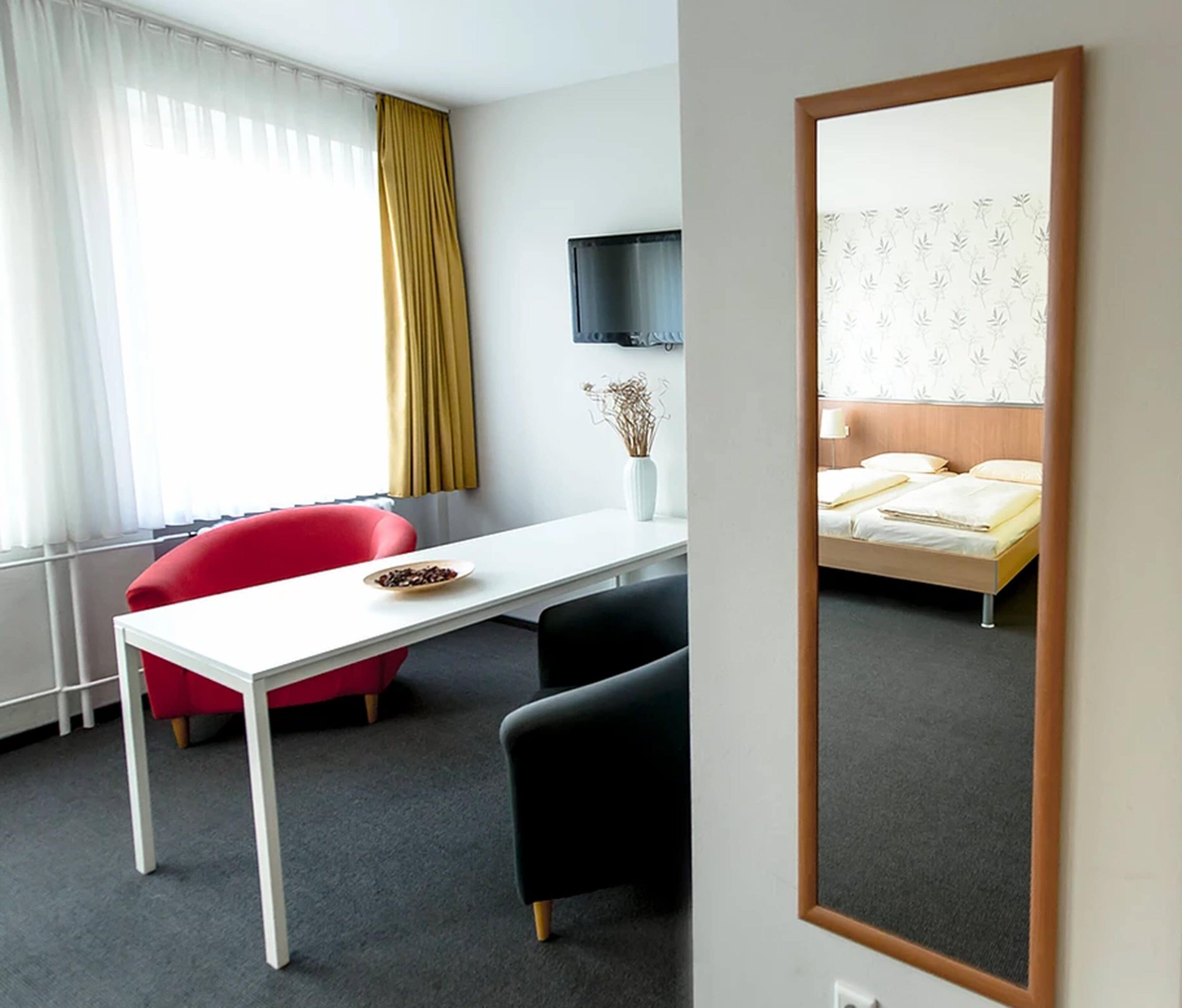 basic double room | living area | flat-screen tv