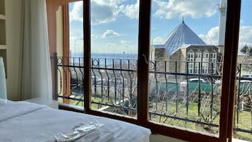 Standard Triple Room, Private Bathroom, Sea View | Desk, laptop workspace, soundproofing, iron/ironing board