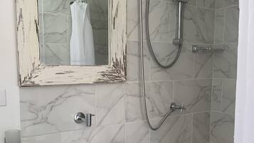 Shower, hair dryer, towels, toilet paper