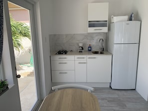 Fridge, microwave, stovetop, coffee/tea maker
