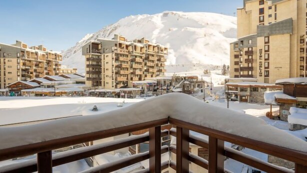 A snow-covered mountain with a hotel and buildings in the foreground. - Le Curling B (Val Claret) by Interhome (Tignes)