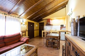 Una televisión, una chimenea, videojuegos, un reproductor de DVD