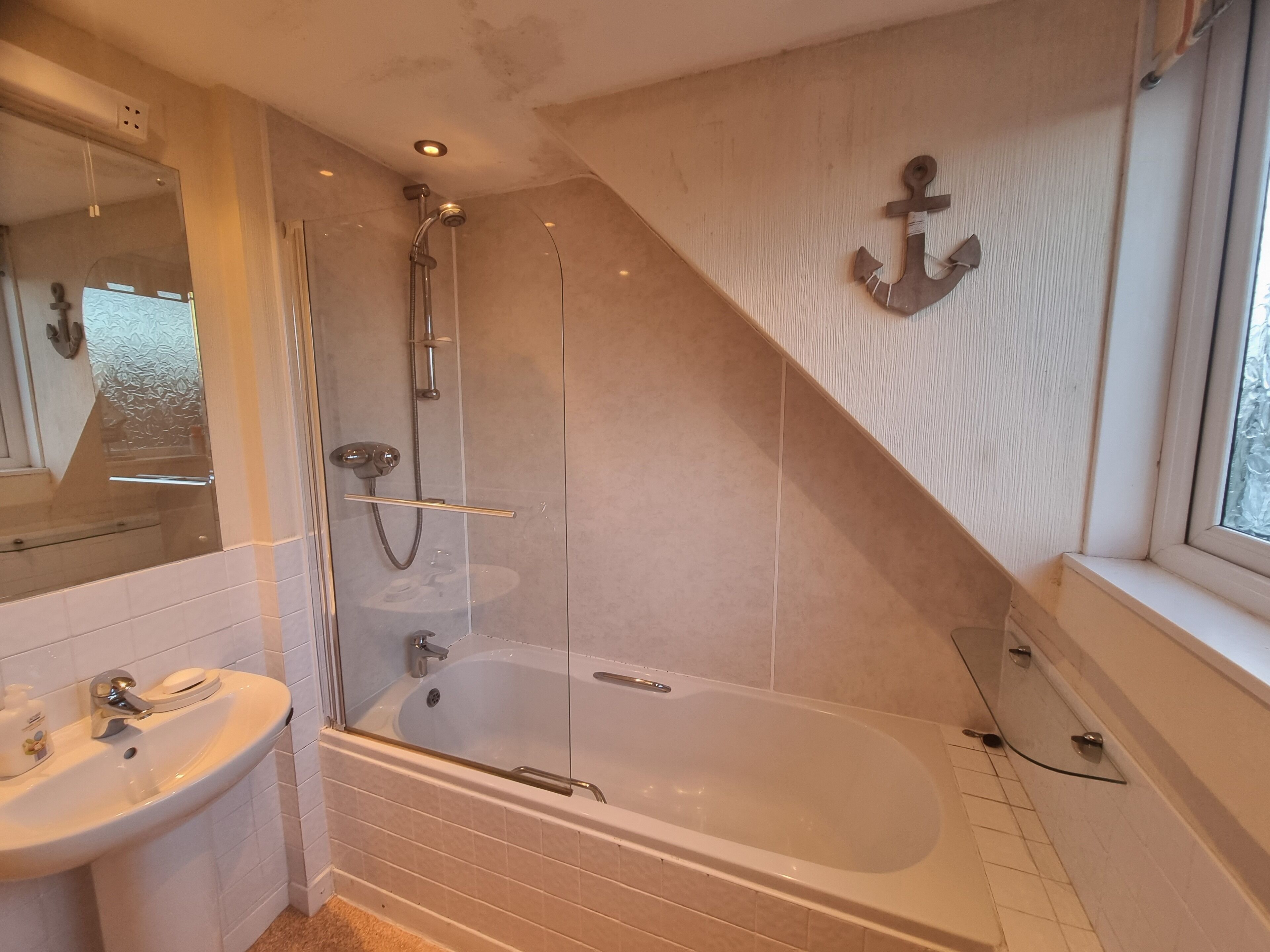 Combined shower/tub, hair dryer, towels, soap