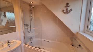 Combined shower/tub, hair dryer, towels, soap
