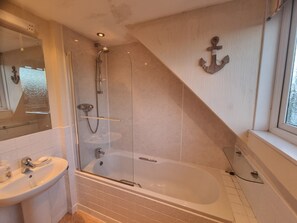 Combined shower/tub, hair dryer, towels, soap