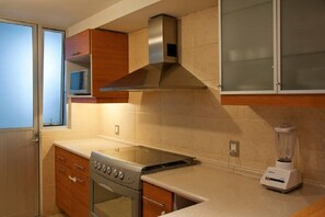 Family Apartment, 3 Bedrooms | Private kitchen | Full-size fridge, microwave, oven, cookware/dishes/utensils
