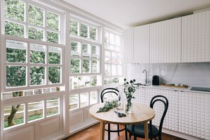 Fridge, microwave, stovetop, coffee/tea maker