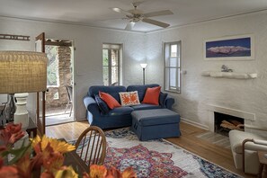 Flat-screen TV, fireplace, DVD player, books