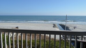 A beach with a wooden deck and a view of the ocean. - Surfwatch III 205 - Oceanfront Condominium in Surfside Beach (Surfside Beach)