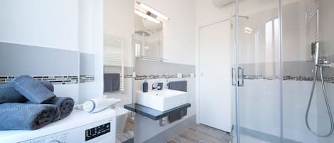Hair dryer, towels, soap, shampoo