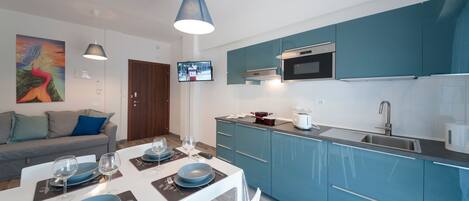 Fridge, microwave, stovetop, coffee/tea maker