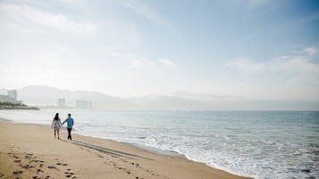 On the beach, sun loungers, beach towels