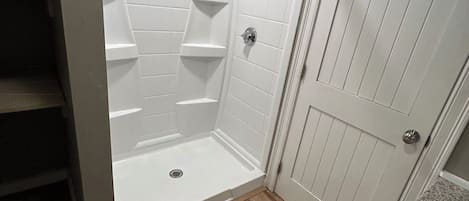 Shower, hair dryer, towels, shampoo