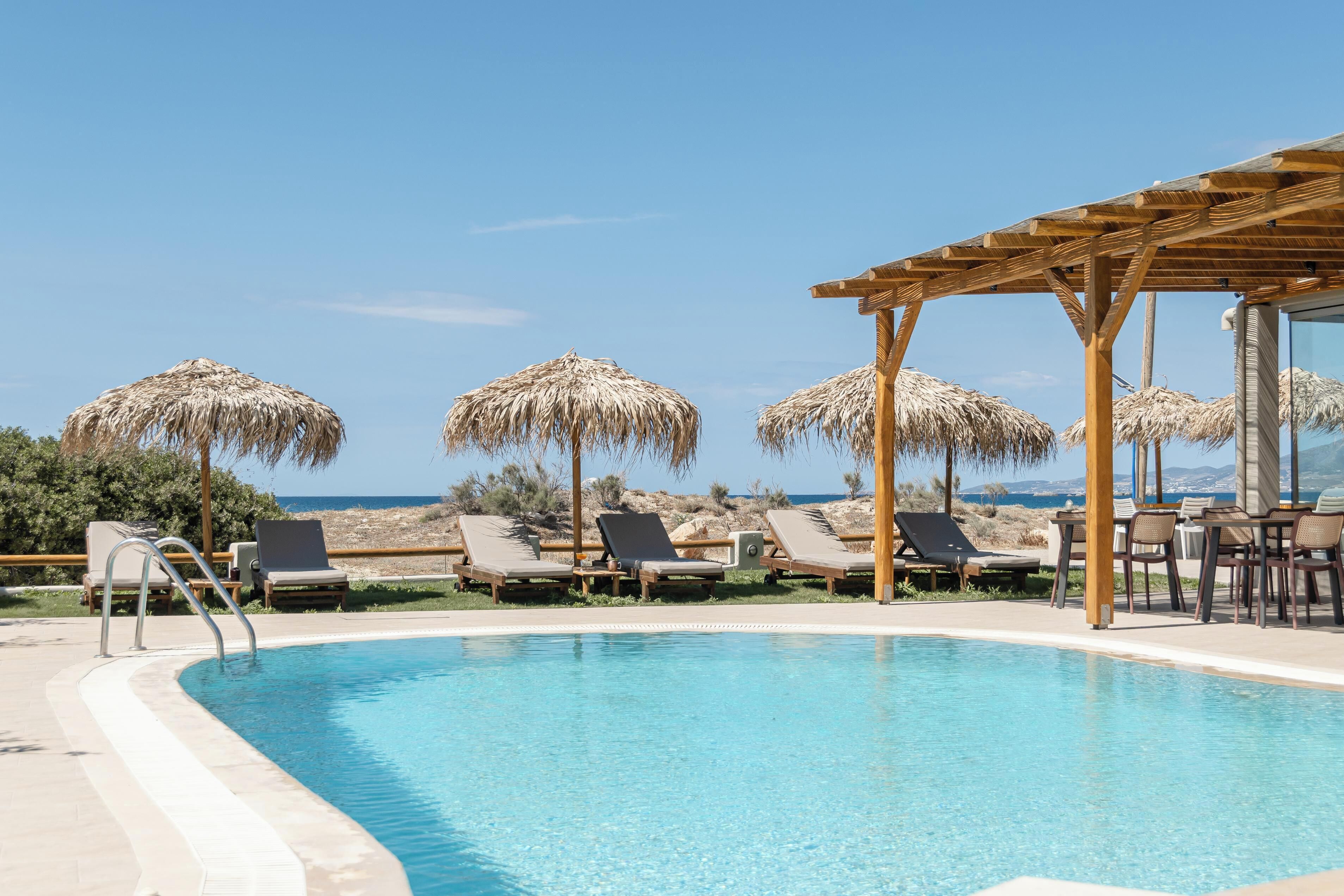 Outdoor pool, pool umbrellas, sun loungers