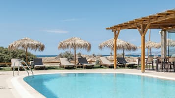 Outdoor pool, pool umbrellas, sun loungers