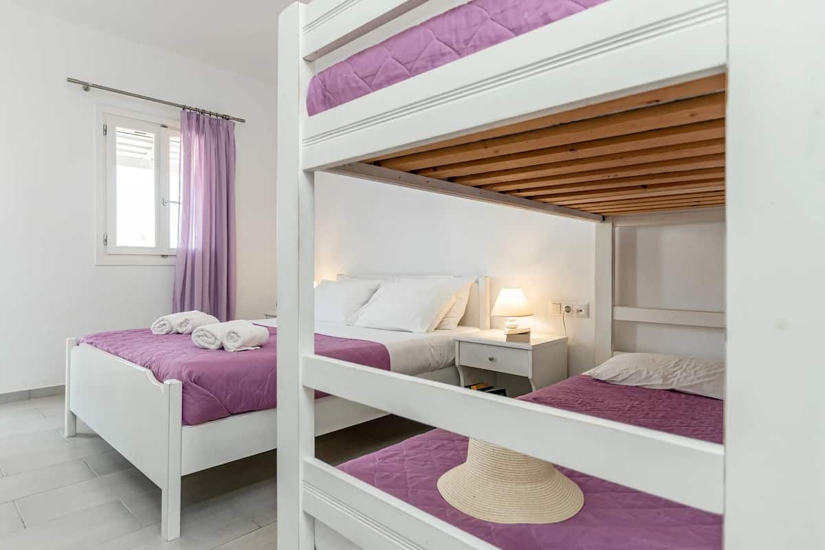 Premium Quadruple Room | Pillowtop beds, in-room safe, desk, soundproofing