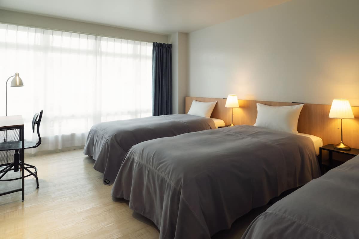 Standard Triple Room, Non Smoking | 1 bedroom, in-room safe, individually decorated, desk
