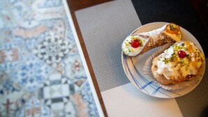 A plate with pastries on a table.